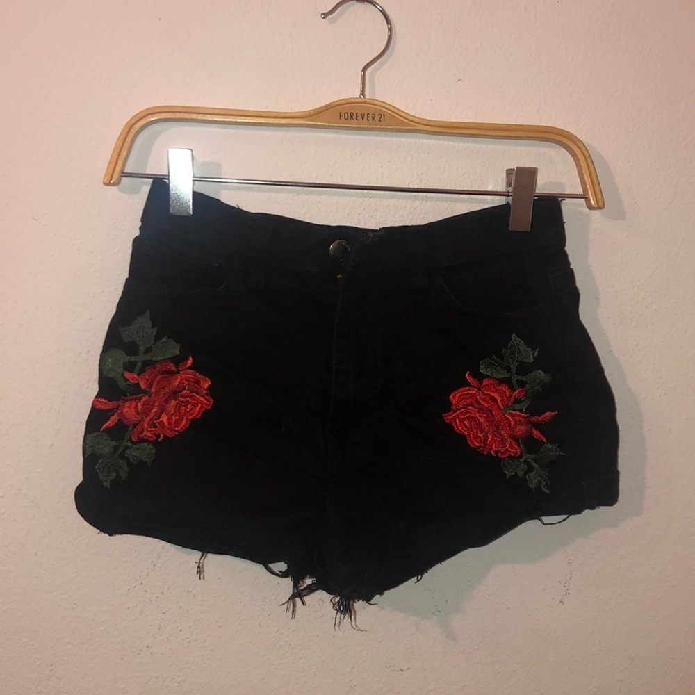 Black distressed shorts with flowers